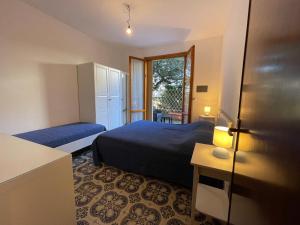 Postel nebo postele na pokoji v ubytování Appartamenti Pino Italico