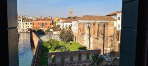 a view of a city with a river and buildings at Hotel Cannaregio 2357 in Venice