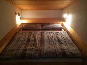 Postel nebo postele na pokoji v ubytování Haus Wutzl