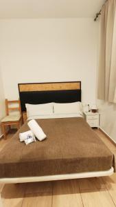Posteľ alebo postele v izbe v ubytovaní Hostal Balkonis