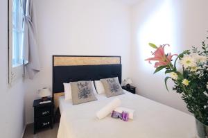 Posteľ alebo postele v izbe v ubytovaní Hostal Balkonis