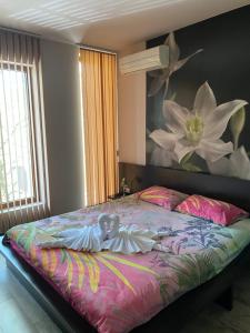 מיטה או מיטות בחדר ב-Апартамент Мегилукс