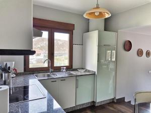 Kuchyň nebo kuchyňský kout v ubytování Casa Barizo- Malpica