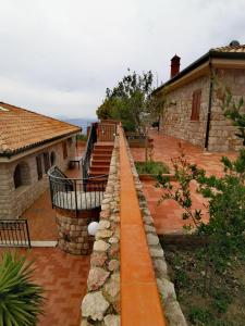a house with a walkway leading to a yard at Villa Verde in Cefalù