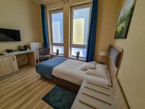 Posteľ alebo postele v izbe v ubytovaní Antonińska Hotel & Apartamenty + 37 fotografií