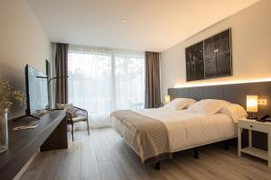 Säng eller sängar i ett rum på Soraluze Hotela