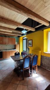 a kitchen with a large wooden table and chairs at Casa Beatrice in Bolsena