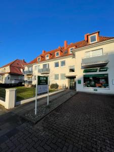 a buy sign in front of a building at Goethestrasse Appartements in Hameln