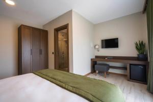 Posteľ alebo postele v izbe v ubytovaní WEST HOUSE EXCLUSIVE HOTEL