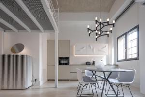 A kitchen or kitchenette at Fornace Loft with Dependance R&R
