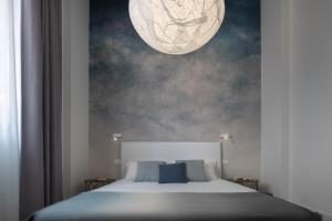 A bed or beds in a room at Fornace Loft with Dependance R&R