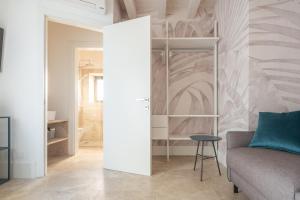 A bed or beds in a room at Fornace Loft with Dependance R&R