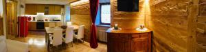 a kitchen with a table and chairs in a room at La Maison de Clémence in Saint-Rhémy-en-bosses +56 photos