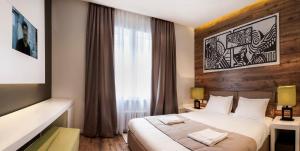 En eller flere senger på et rom på Eden Garden Suites