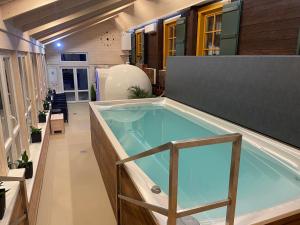 a hot tub in the middle of a house at Apartments Haltmar in Ostružná