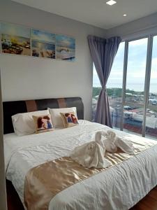Postel nebo postele na pokoji v ubytování Sekinchan SeaView Homestay 034 高楼看海阳台民宿