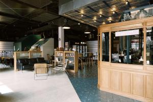 a restaurant with chairs and tables in a room at URSIDE Hotel Shanghai The Bund in Shanghai