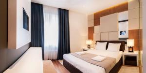 En eller flere senger på et rom på Eden Garden Suites