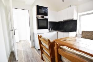 TV a/nebo společenská místnost v ubytování Moderne Ferienwohnung mit Sat-TV & WLAN