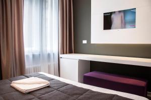 En eller flere senger på et rom på Eden Garden Suites