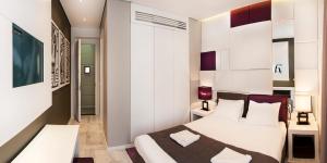 En eller flere senger på et rom på Eden Garden Suites