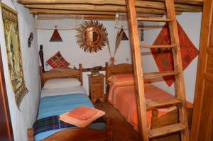 a bedroom with two bunk beds and a ladder at La Dimora di Gaspare in Locogrande