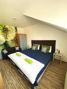A bed or beds in a room at Bóbita Apartman