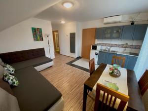 A kitchen or kitchenette at Bóbita Apartman