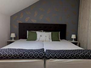 Posteľ alebo postele v izbe v ubytovaní Bóbita Apartman