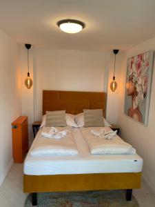 Postel nebo postele na pokoji v ubytování Nova Apartamenty Rewa