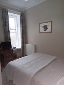 Postel nebo postele na pokoji v ubytování Fassfern Guesthouse