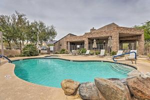 a swimming pool in front of a house at Golf Course View and Pool Access Gold Canyon Gem in Gold Canyon