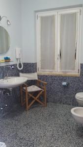 Ett badrum på VILLA FLORA ARGENTARIO