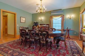 a dining room with a table and chairs at Emilyville Inn in Campbellford