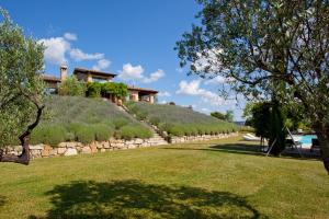 a house on top of a hill with a yard at CASALE DELLE LAVANDE 10, Emma Villas in Todi