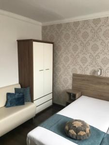Posteľ alebo postele v izbe v ubytovaní Oleander Apartman
