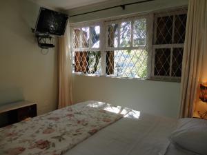 Posteľ alebo postele v izbe v ubytovaní Casa Caminho do Corcovado