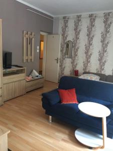 Televízia a/alebo spoločenská miestnosť v ubytovaní Oleander Apartman