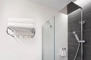 a bathroom with a shower stall and a toilet at B&B Hotel Murcia in Murcia