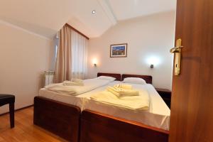 Postel nebo postele na pokoji v ubytování Apartments & Accommodation Stojic