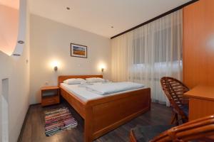 Postel nebo postele na pokoji v ubytování Apartments & Accommodation Stojic + 29 fotografií