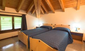 Postel nebo postele na pokoji v ubytování Casa Lori