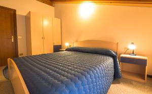 Postel nebo postele na pokoji v ubytování Casa Lori