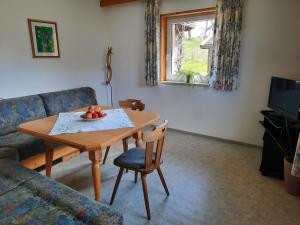 TV a/nebo společenská místnost v ubytování Grünwald Chalet