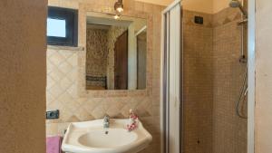 A bathroom at PODERE TORRICELLA 16, Emma Villas