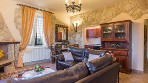 A seating area at PODERE TORRICELLA 16, Emma Villas