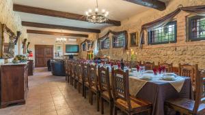 A restaurant or other place to eat at PODERE TORRICELLA 16, Emma Villas