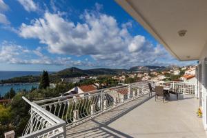 a balcony with a view of the ocean at Apartments Villa Enzian in Mlini