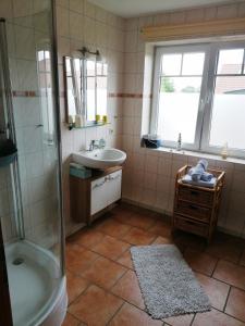 a bathroom with a shower and a sink and a tub at Poeler Ostseeidyll in Insel Poel