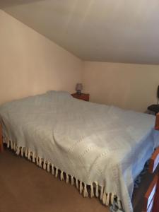 Un pat sau paturi într-o cameră la Les pins ensoleilles